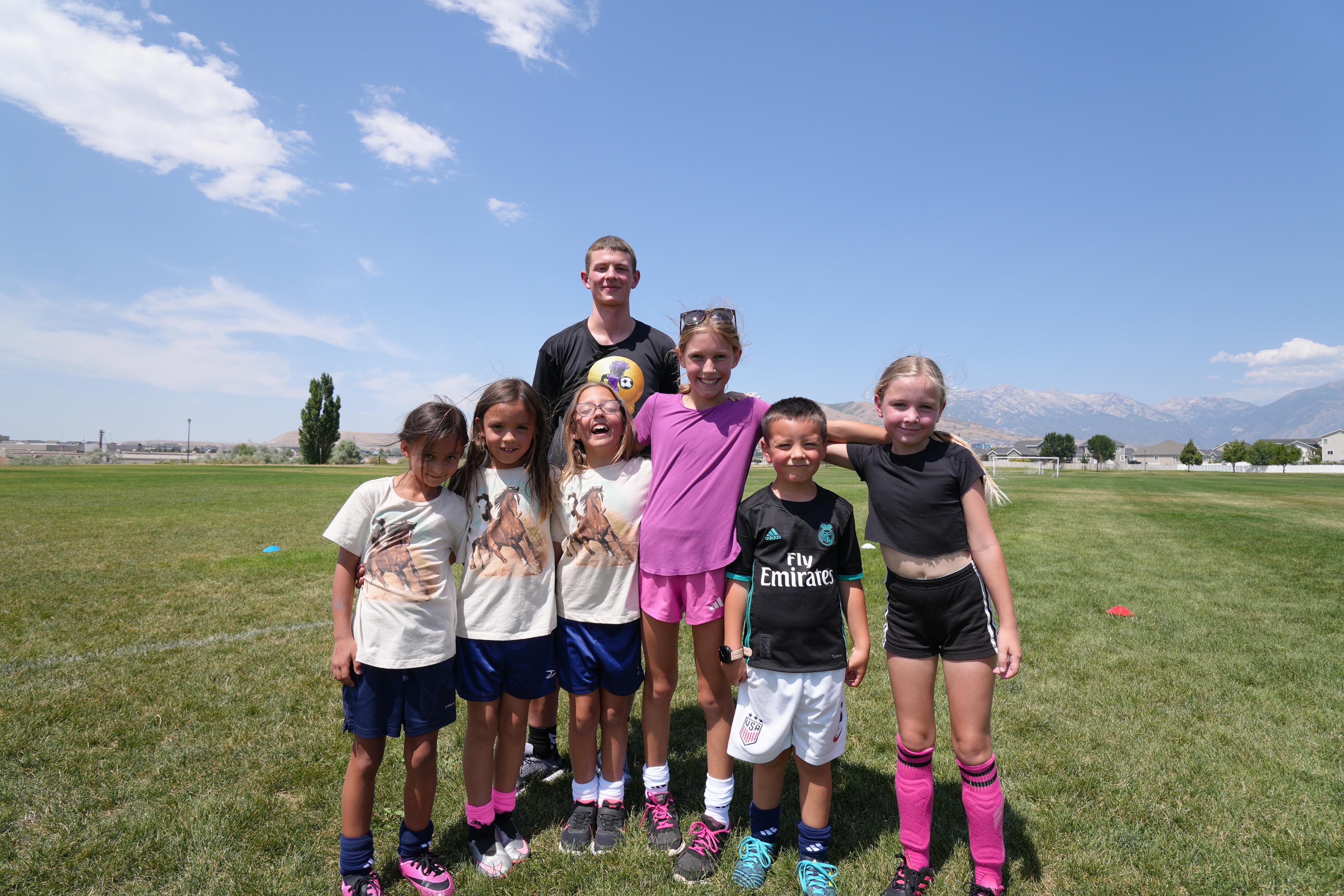 Coach Niko training a group of young soccer players